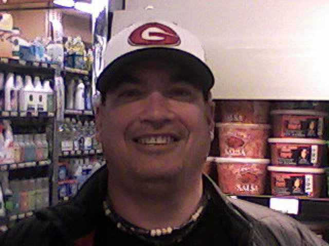 Gunn softball coach Matt Maltz near the knish section of Piazza's