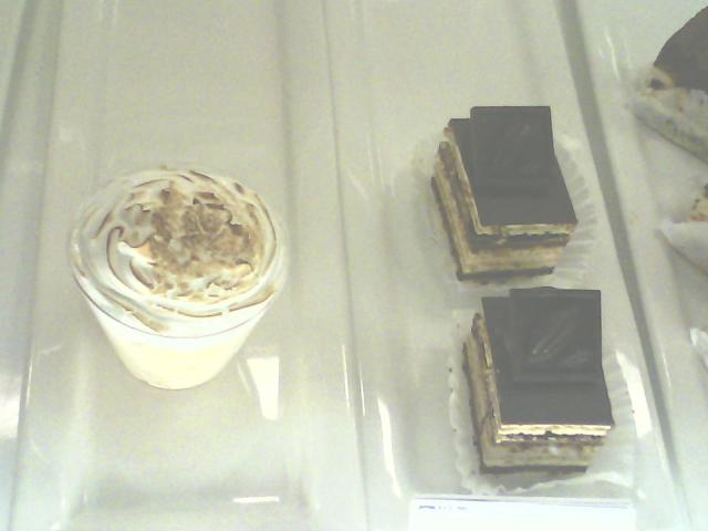 With apologies to both Wayne Thiebaud and John McCrea, here are the Tres Leches treat and Opera almond cakes from Coupa, although the rock band Cake claims their name denotes a dense quality like when your boot sinks into the mud and emerges "caked"