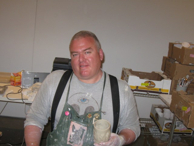 Ceramics master and conceptual artist Ehren Tool of Berkeley, Calif., in residence at Palo Alto Art Center, Saturday, June 7, 2014, 70 years and 1 day after D-Day, turning swords into ploughshares, clay into ceramics and tooth-holders