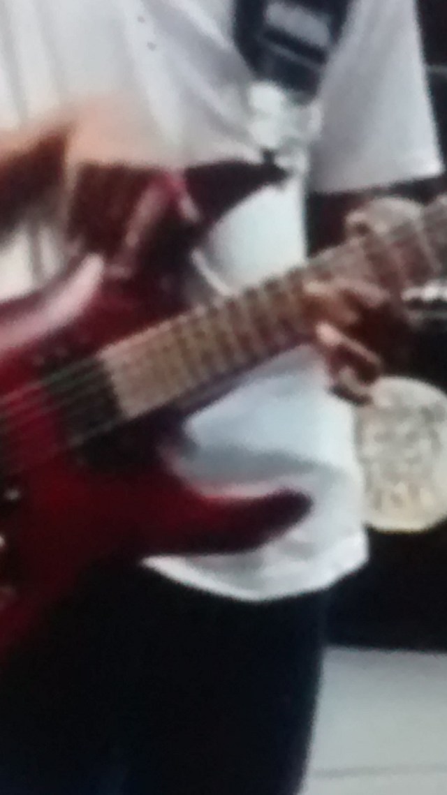Screen grab of Malcolm Brickhouse, guitar, in 2013 busking at Times Square