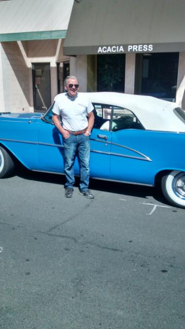 A guy named Mario, and his 1955 or 1954 blue, American beauty; note the Ferrari t-shirt, State Street Los Altos, August, 14, 2014