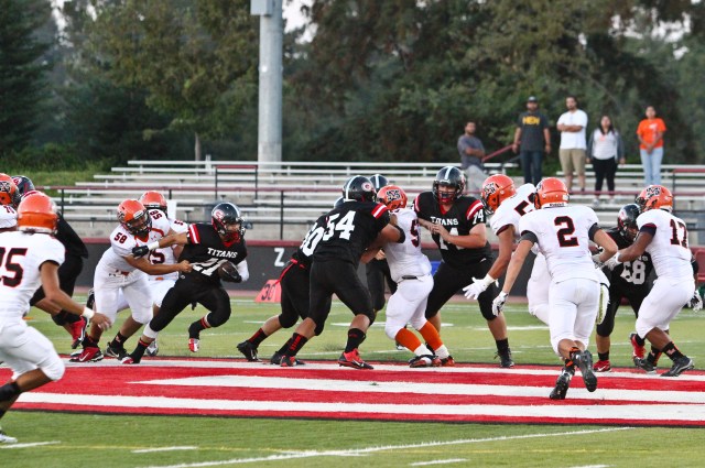 Gunn football photo by Mat t Maltz class of 1982 which feature coincidentally his son Andrew Maltz, (74)