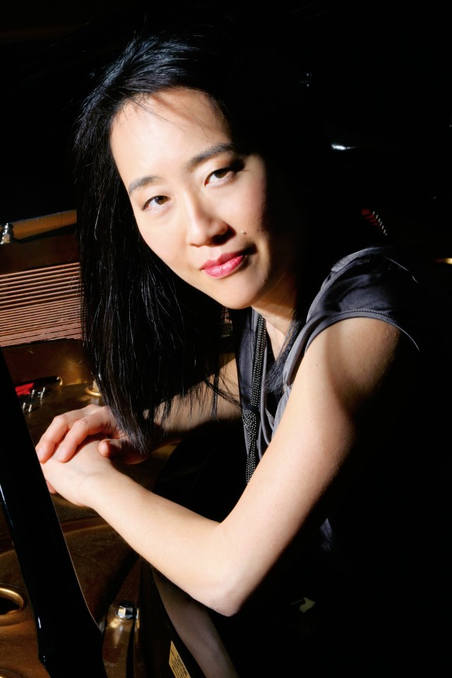 Helen Sung contemplating a West Coast mini-tour and a large bottle of Belgian ale