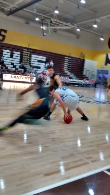 San Ramon guard Keith Smith and teammate harass Davis guard in full court press, in 99-62 romp at St. Francisco tourney Saturday
