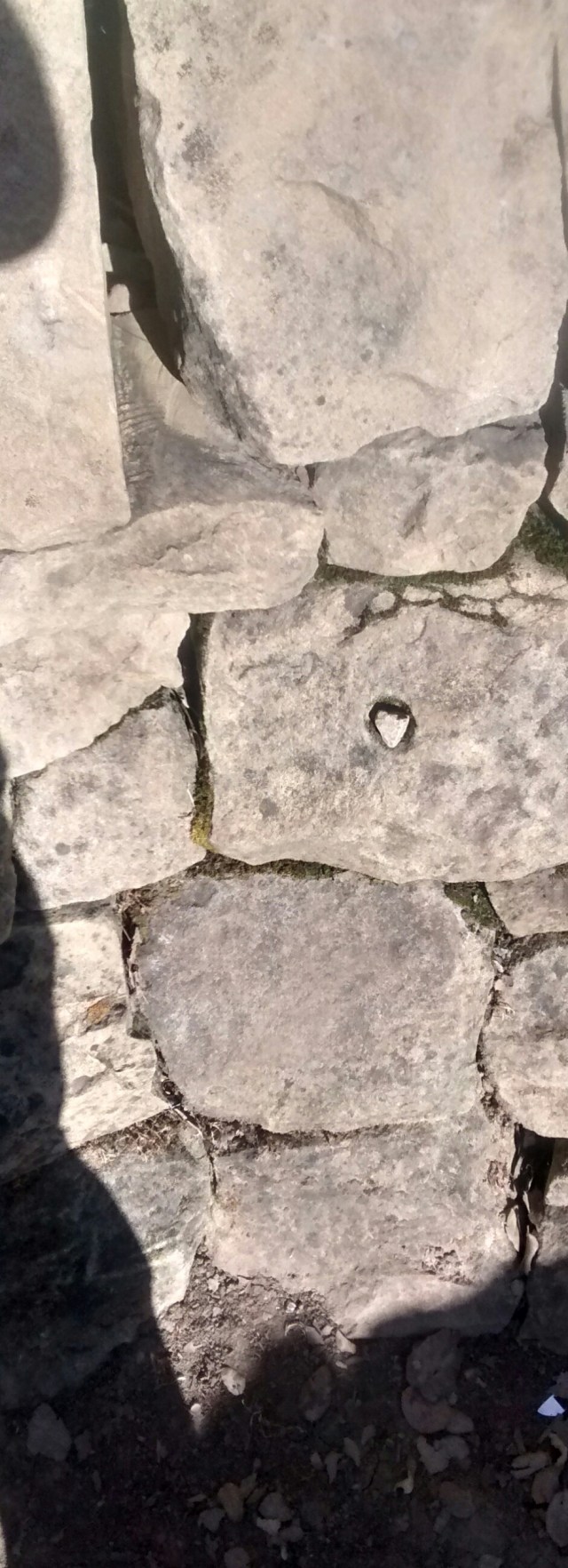 The wee stone, in the nook, placed by whom?