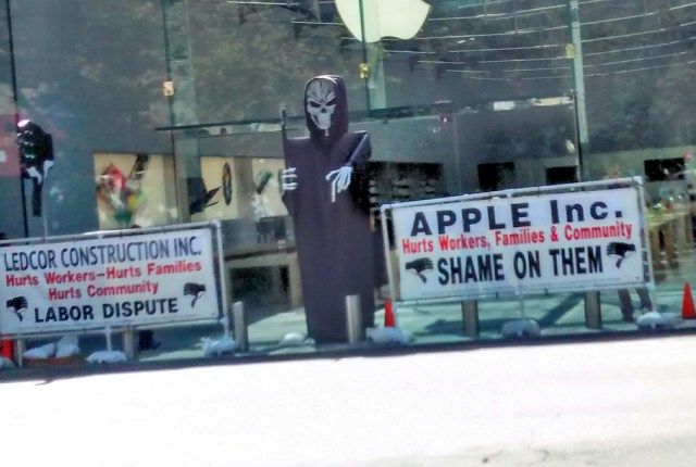 There could be six jobs here not two holding these signs and props, or why not get a permit to build and display at Lytton Plaza?
